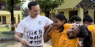 Ethiopian woman crying into a man's arms after just having completed aliyah.